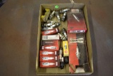 Assortment of Champion spark plugs both new and used