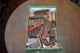 Assorted vintage tools such as scrapers, Allen wrenches, chain breaker, and chalk line