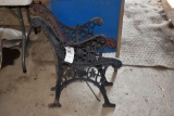 Two metal garden bench ends