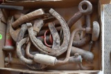 Assortment of vintage tools, horse shoes, and clevis