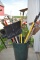Assortment of Yard Tools with Rubbermaid Garbage Can