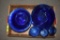 Blue Glass Candle Holder, Saucers, Creamer and Glasses