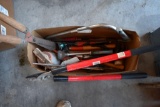 Box of yard tools: Craftsman pruner, hedge clipper, brush saw, paint mixer, water nozzles
