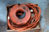 Box of extension cords and reel