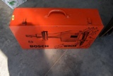 Empty Bosch Metal Case, Gallon of Acrylic Primer Surfacer, Gallon of Mineral Spirits
