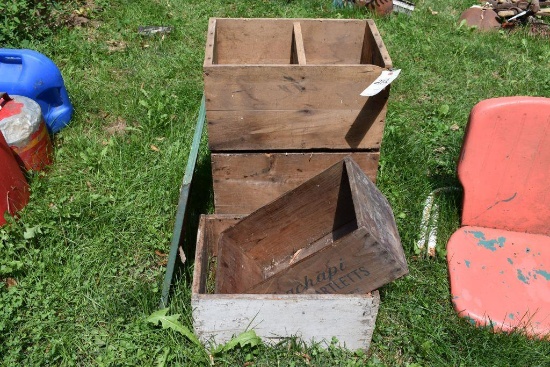 Wooden boxes, some with writing
