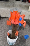 (2) Galvanized Garbage Cans: One Containing Burlap Sacks, Marking Flags