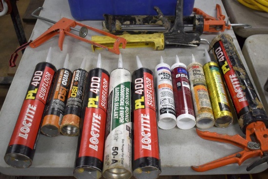 Bin Of Assorted Caulk and Caulk Guns