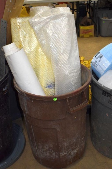 Garbage Can Containing Open Rolls of Dura Skrim