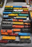 Assorted HO Scale Railroad Cars: Engines, Box Cars, Material Cars