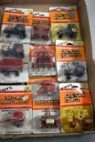 (11) Ertl Tractors and Implements on Cards, 1/64