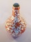 Antique Oriental orange and white swirl floral vase