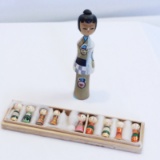 Kokeshi Dolls - 1 Hand Painted Wooden Doll & Nine 1 1/2 Inches Tall Doll Fa