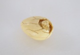 Ivory Cracked Egge With Hatching Bird