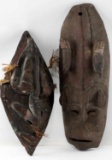 LOT OF TWO CARVED SHIELD  SHAPED AFRICAN MASKS