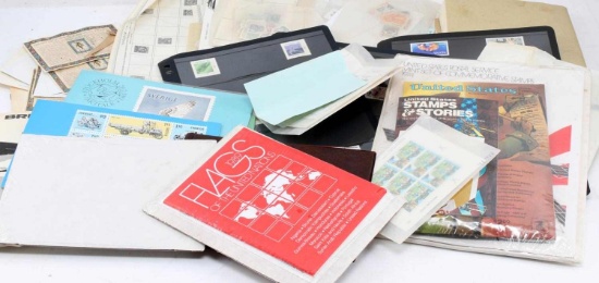 LARGE LOT OF WORLD POSTAGE STAMPS AND BOOKS
