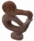 TUFF CARVED ANTHROPOMORPHIC BIRD FIGURE