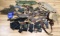 LARGE LOT OF HOLSTERS AMMO SLEEVES RIFLE REST LOT