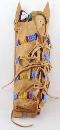 SMALL LEATHER BEADED DOLL ON CRADLEBOARD