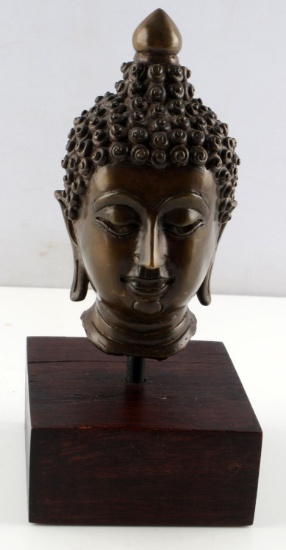 BRONZE BUDDHA HEAD SCULPTURE ON WOOD BASE