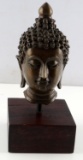BRONZE BUDDHA HEAD SCULPTURE ON WOOD BASE