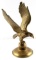 MID CENTURY BRASS EAGLE PERCHED UPON THE GLOBE