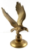 MID CENTURY BRASS EAGLE PERCHED UPON THE GLOBE