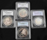 GROUPING OF FOUR SILVER DOLLAR COMMEMORATIVES PCGS