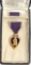 WWII NAMED AND CASED PURPLE HEART MEDAL
