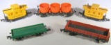 5 small Bachmann cars: 2 caboose,2 open cars, one vat car