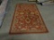 Oriental Rug-made in India, 70% cotton, 25% rayon, 5% Polyester. 4.8' x 7.6'. small tear on corner.