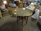 Brass tray table with wood base. Tray is 29