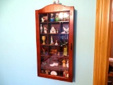 Wood curio cabinet with knicknacks