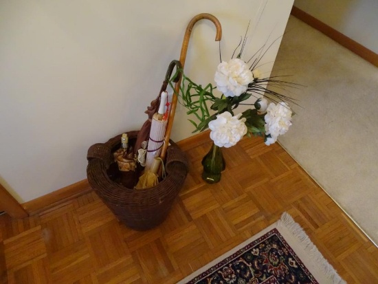 Basket full of umbrellas, parasol, cane and side vase