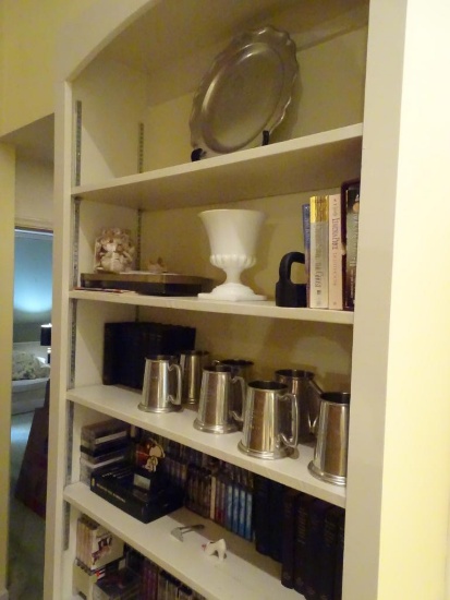 Everything on bookshelf!-Platter, championship mugs, cassette tapes, books.