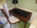 Wood desk w/leather inlay and chair w/ cane back. 43