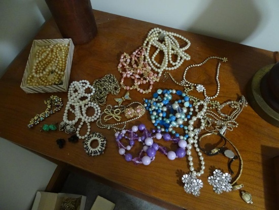 Costume Jewelry on table and in jewelry box