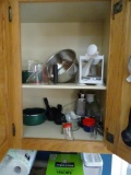 4 cabinets of bakeware. Includes a veggie spiralizer, grater, pots/pans, measuring cups/spoons.