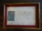 Vintage small framed replica of a Confederate flag made out of flag remnants.