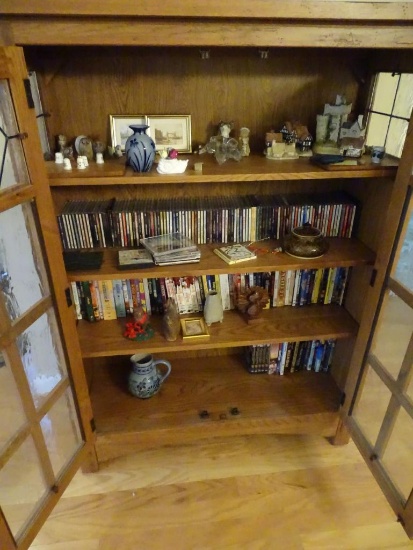 All items on shelves-CDs, books, pottery, etc.