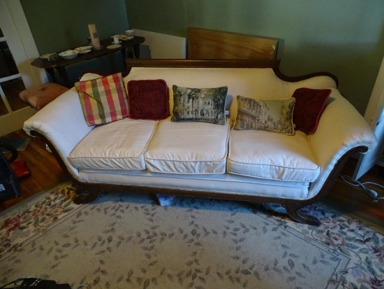 Vintage claw foot sofa with pillows