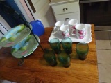 Items on table-Plate Rack w/ 3 Gates Ware plates, White platter, 5 green glasses, blue Pitcher