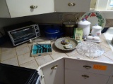 Items on Counter-Toaster Oven, steak knives, Ice Bucket, Cake Plate Canister, Metal serving trays