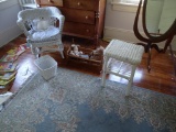 Wicker chair and table, basket and small wooden crib w/toys.