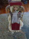 Vintage doll buggy w/ porcelain doll