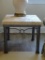 Coastal End table w/metal base and top made of poly/stone. Glasses leave no stains!