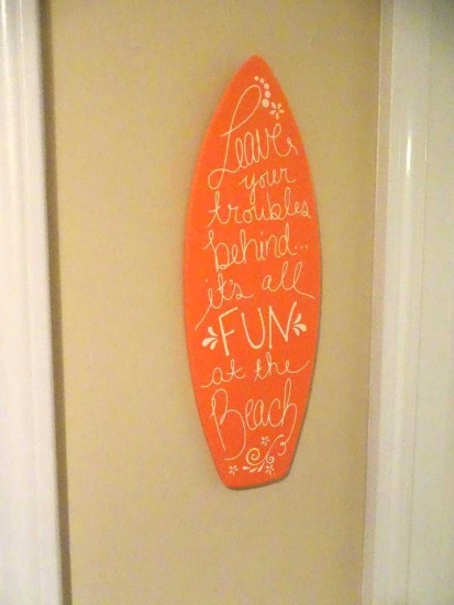"Leave your Troubles Behind...It's all Fun at the Beach" wall hanging and small picture.