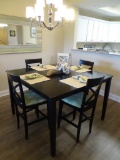 Black high top table and 8 chairs. Table: 54'