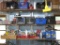 3 rows items: Books (some western), Motor oil, vintage gas can, pliers, fuel injector cleaner, etc.