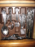 Set of stainless flatware plus 2 drawers of placemats and linens